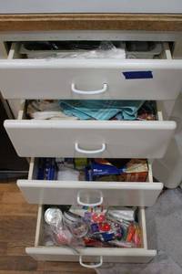 lot 73 image: Silverware set, knives, kitchen hand towels, plastic bags, Reynolds wrap, birthday candles