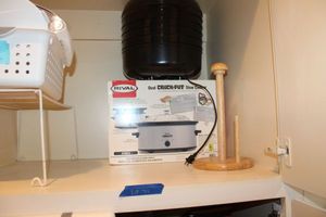 lot 79 image: Rival oval Crock-Pot, Food dehydrator, paper towel holder