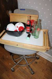 lot 270 image: Rolling bar stool with Coca-Cola bottles and  piggy bank