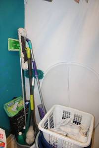 lot 83 image: Swiffer mops, ceiling fan cleaners, and laundry baskets