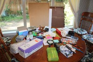 lot 274 image: Office desk supplies includes desk light, copy paper, greeting cards and corkboard.