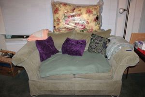 lot 96 image: Bassett Loveseat - 6x41x31- with blankets and pillows