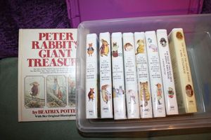 lot 101 image: Beatrix Potters Peter Rabbit book and VHS movies