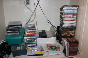 lot 103 image: DVD movies, CDs, and cassette tapes