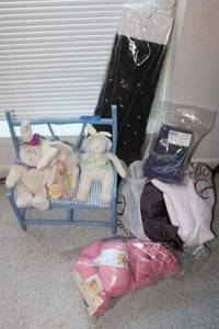 lot 261 image: Spring plush bunnies an bench, pink yarn and purple and pink fabrics