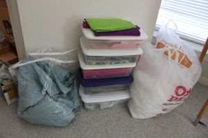 lot 241 image: Quilting fabrics, Poly-fil, curtains, poster frame, adjustable light