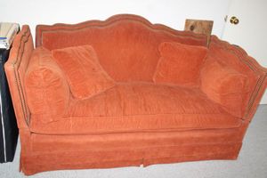 lot 242 image: Vintage orange sofa couch with button trim