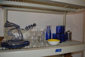 lot 281 image: Blue glass dishes, tea cannister, Silver spoons, clear glass candle holders, white and yellow glass bowl