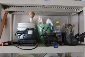 lot 286 image: spotlight with car adapter, finishing sander, orbital sander and buckets