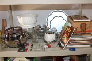 lot 287 image: Recipe books, cake pans, Pyrex measuring cups, bowls and more