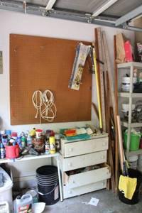 lot 289 image: Light bulb changing kit, peg board, wall peg boards, storage dresser with contents, partial oak wall rail and more