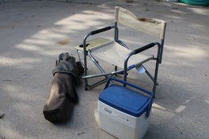 lot 316 image: Folding yard chairs and personal Coleman cooler
