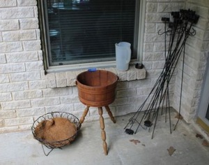 lot 334 image: Metal garden candle stakes, wooden plant stand and metal hanging planter