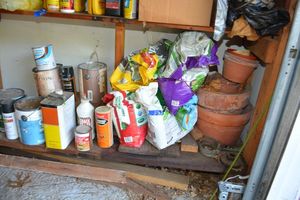 lot 253 image: Gardening and yard items terra cotta plant pots, grass feed, paint cans and more