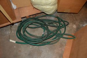 lot 211 image: Garden hose and work rags