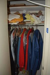 lot 207 image: Coat closet contents jackets and mailers