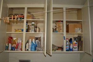 lot 204 image: Household and laundry cleaners, light timers, staple gun, iron, extension cords and more