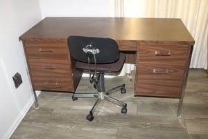 lot 134 image: Vintage laminate and chrome desk (with contents) with rolling office chair. Desk measures Approx. 54x24x29