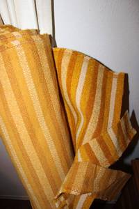 lot 145 image: Roll of yellow stripe fabric (same kind used throughout this home on various furniture pieces)