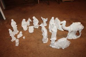 lot 150 image: LARGE white ceramic Nativity figurines, narrow mirror, childs camping chair and more. Closet contents, see all photos.