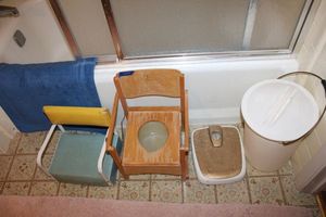 lot 151 image: Vintage wooden childs potty chair, booster chair, scale and waste bucket