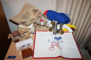 lot 176 image: Vintage GE timer, Avon Winnebago Motor Home bottle, Pennies paper weight, cross-stitch Mickey Mouse, brass candle sticks and more
