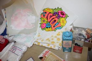 lot 32 image: Contents of Dresser crafts, iron-on patches, yarn, and more