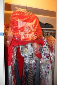 lot 41 image: Clothes closet mens ties, womens tops and jackets