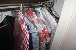 lot 56 image: Clothes closet mens and womens clothes