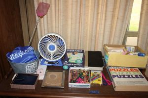 lot 76 image: Misc. lot Puzzle book, personal fan, Bible, Photo frame, power adapter charger and 24KT gold plated locket