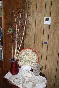lot 88 image: Home dcor Red hobnail vase, peacock feathers, serving platters and dishes