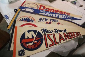 lot 139 image: Vintage sports pendants NY Islanders, Mets, Yankees, Michigan, Texas Rangers and Dallas Cowboys