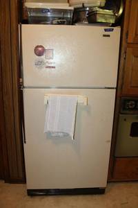 lot 109 image: Kenmore hi-efficiency Refrigerator and Freezer model 8609981. Measures 33x33x66