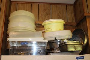 lot 110 image: Baking pans, Tupperware plastic storage containers, styrofoam ice,  container, Misc. utensils