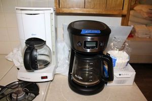 lot 112 image: 2 Coffee makers (Oster and Mr. Coffee) with filters