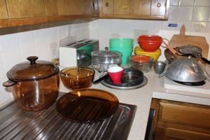 lot 114 image: Brown glass cookware, toaster, strainers, glass nesting bowls and more