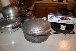 lot 116 image: Cast iron skillet, electric skillet, electric food slicer and more