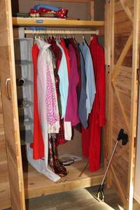 lot 135 image: Clothes closet items womens undergarments, robe, grabber, jackets