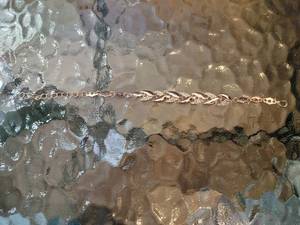 lot 82 image: Rosy Tone Costume Jewelry Bracelet