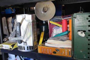 lot 67 image: Camping Items, Cookstove, Latern, Fire Starter, Extra propane Tanks, Flashlights, Camp Shower Frying Pan and More