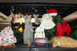 lot 72 image: Christmas Items, Singing Tree, Class Slowman, Angle Ornaments, Garland, Gold Beads and More