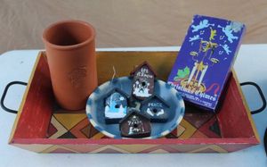 lot 29 image: Wooden Tray with Christmas Deco including a Terra Cotta Christmas Bowl, Terra Cotta Utensil Holder and More