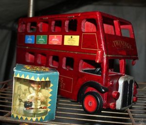 lot 49 image: Twinnings of London Wooden Bus (missing one wheel) and Slapstix Bite-sized Dr. Ben Dover Figure