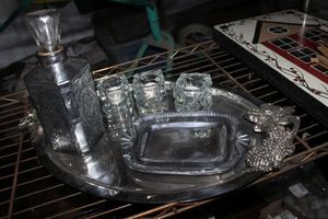 lot 91 image: Silver Toned Serving Trays, large and small, Ice Like Candle Holders and Silver Glass Decanter