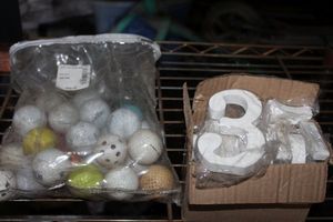 lot 94 image: Bag of Golf Balls and Unfinished Wooden Numbers