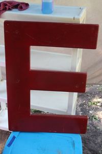 lot 98 image: Fiberglass Red Letter E, Approximately 3x2