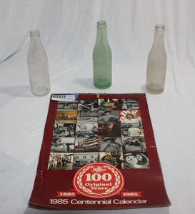 lot 211 image: Vintage Soda Bottles and Calander
