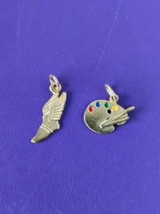 lot 69 image: Lot of 2 - 14K Gold Charms - 2grams