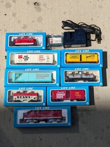 lot 243 image: Life-Like Train Car Bundle w Tracks & Transformer