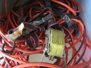 lot 69 image: clear tote of extension cords & wooden box of straps